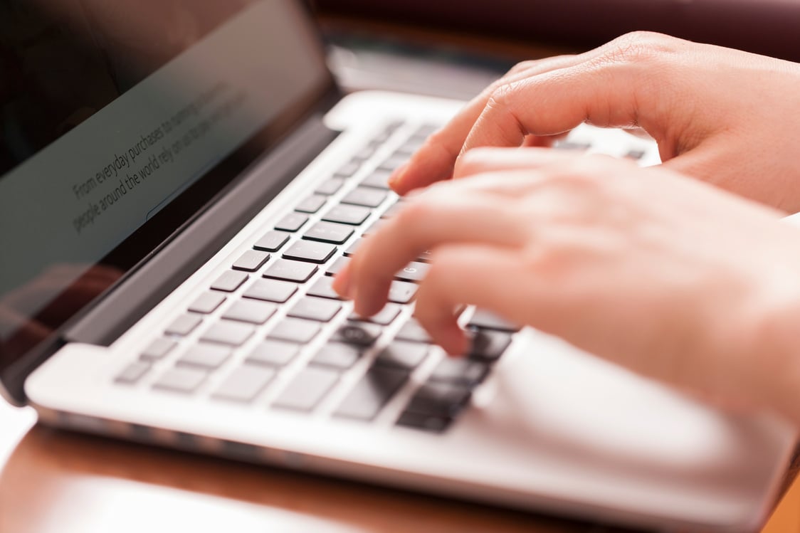 Female hands working on data entry with keyboard